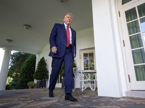 President Donald Trump exits the Oval Office and walks to the Rose Garden to speak to the media at the White House on July 14, 2020 in Washington.