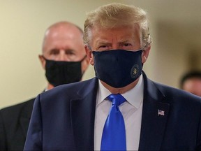 President Donald Trump wears a mask while visiting Walter Reed National Military Medical Center in Bethesda, Maryland July 11, 2020.