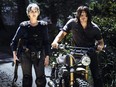 Norman Reedus as Daryl Dixon, Melissa McBride as Carol Peletier in The Walking Dead.