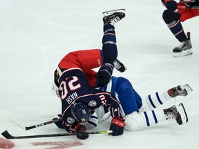 Columbus Blue Jackets centre Riley Nash collides with Toronto Maple Leafs centre Auston Matthews earlier this season.