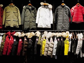 Coats hang in the show room of the Canada Goose Inc. manufacturing facility in Toronto, Ontario, Canada, on Thursday, Feb. 27, 2014.