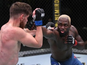 LAS VEGAS, NEVADA - AUGUST 01: In this handout image provided by UFC, (R-L) Derek Brunson punches Edmen Shahbazyan in their middleweight fight during the UFC Fight Night event at UFC APEX on August 01, 2020 in Las Vegas, Nevada.