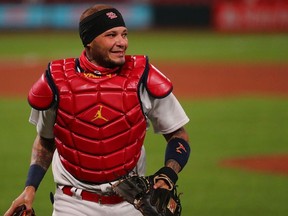 Yadier Molina of the St. Louis Cardinals returns to the dugout after the final out of the sixth inning against the Cincinnati Reds at Busch Stadium on August 20, 2020 in St Louis, Missouri.