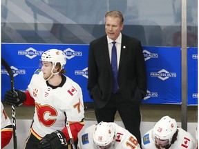 EDMONTON, ALBERTA - AUGUST 06: Geoff Ward head coach of the Calgary Flames looks on against the Winnipeg Jets during the first period in Game Four of the Western Conference Qualification Round prior to the 2020 NHL Stanley Cup Playoffs at Rogers Place on August 06, 2020 in Edmonton, Alberta.