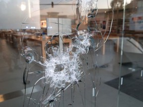 A broken storefront window is seen after parts of the city had widespread looting and vandalism, on August 10, 2020 in Chicago, Illinois. Police made several arrests during the night of unrest and recovered at least one firearm.