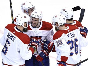 Canadiens' Jonathan Drouin, centre, is surrounded by teammates after Shea Weber's goal during Game 1 of the Eastern Conference quarter-finals last week.