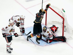 Reilly Smith #19 of the Vegas Golden Knights scores the game-winning goal at 7:13 of overtime against the Chicago Blackhawks to win the game 4-3 in Game 2 of the Western Conference First Round during the 2020 NHL Stanley Cup Playoffs at Rogers Place on August 13, 2020.