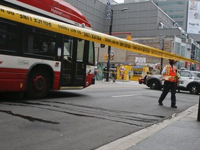 Police investigate after a man ran into a bus on Yonge St., near Gould St.