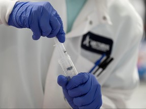 A scientist conducts research on a vaccine for the novel coronavirus (COVID-19) at the laboratories of RNA medicines company Arcturus Therapeutics in San Diego, California, U.S., March 17, 2020.