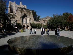 Students walk on the campus of Yale University in New Haven, Connecticut, Oct. 7, 2009.