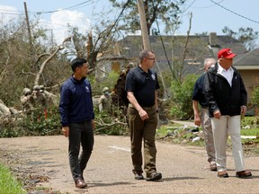 U.S. President Donald Trump accompanied by Department of Homeland Security (DHS) Secretary Chad Wolf and Federal Emergency Management Agency (FEMA) Administrator Pete Gaynor are seen during a visit to areas damaged by Hurricane Laura in Lake Charles, Louisiana, Aug. 29, 2020.