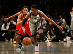Brooklyn Nets guard Caris LeVert (22) and Toronto Raptors guard Kyle Lowry (7) pursue a loose ball during the first half at Barclays Center. Mandatory Credit: Andy Marlin-USA TODAY Sports ORG XMIT: USATSI-407526