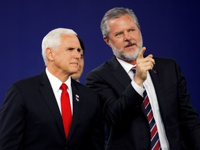 Liberty University President Jerry Falwell Jr. and U.S. Vice President Mike Pence prepare to leave at the end of the school's commencement ceremonies in Lynchburg, Va, May 11, 2019.