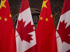 In this file photo taken on December 5, 2017, shows Canadian and Chinese flags taken prior to a meeting with Canada's Prime Minister Justin Trudeau and China's President Xi Jinping at the Diaoyutai State Guesthouse in Beijing.