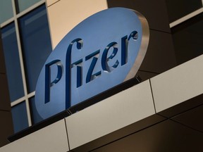 In this file photo a sign for Pfizer pharmaceutical company is seen on a building in Cambridge, Massachusetts, on March 18, 2017.