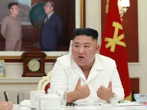 This picture taken on August 5, 2020 and released from North Korea's official Korean Central News Agency (KCNA) on August 6 shows North Korean leader Kim Jong Un speaking at the Fourth Meeting of the Executive Policy Council of the Seventh Central Committee of the Workers' Party of Korea (WPK) at the office building of the Central Committee of the WPK in Pyongyang.
