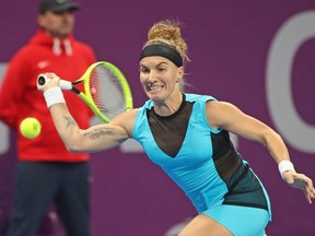 In this file photo Svetlana Kuznetsova of Russia returns the ball to Aryna Sabalenka of Belarus during the semifinals of the Qatar Total Open tournament in Doha, on February 28, 2020.