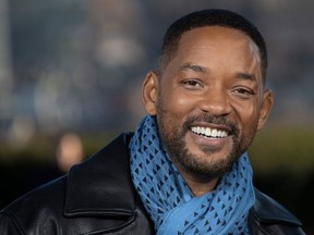 In this file photo taken on Jan. 6, 2020 Will Smith poses at the 'Bad Boys For Life' launching photocall in Paris, in front of the Eiffel Tower.