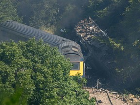 Derailed carriages are seen at the scene of a train crash near Stonehaven in northeast Scotland on Aug. 12, 2020.