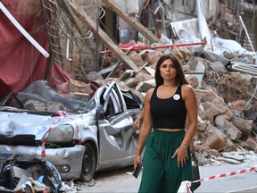A woman walks along Gouraud street in Beirut on Aug. 13, 2020, more than a week after a massive blast ravaged the port and parts of the Lebanese capital.