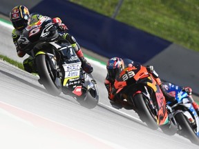 Esponsorama Racing´s French rider Johann Zarco (L) and Red Bull KTM Factory Racing´s South African Brad Binder compete during the Moto GP Austrian Grand Prix at the Red Bull Ring circuit in Spielberg, Austria on August 16, 2020.