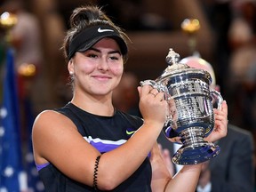 Bianca Andreescu poses with the U.S. Open trophy after beating Serena Williams at USTA Billie Jean King National Tennis Center.