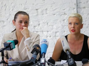 Belarusian united opposition candidate Svetlana Tikhanouskaya and Maria Kolesnikova, a representative of politician Viktor Babariko's campaign office, attend a news conference following the presidential election in Minsk, Belarus August 10, 2020. REUTERS/Vasily Fedosenko ORG XMIT: MOS