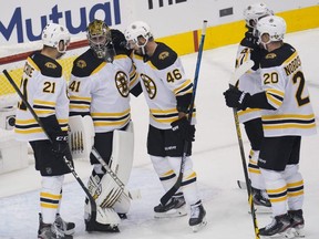 Bruins goaltender Jaroslav Halak celebrates with teammates after defeating the Lightning in Game 1 of the second round of the 2020 Stanley Cup Playoffs at Scotiabank Arena in Toronto, Sunday, Aug. 23, 2020.