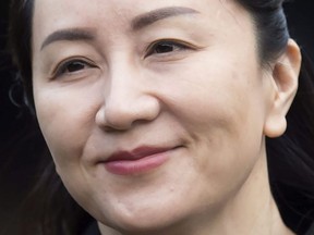 In this Jan. 21, 2020, file photo, Huawei chief financial officer Meng Wanzhou, who is out on bail and remains under partial house arrest after she was detained last year at the behest of American authorities, leaves her home to attend a hearing in British Columbia Supreme Court, in Vancouver.