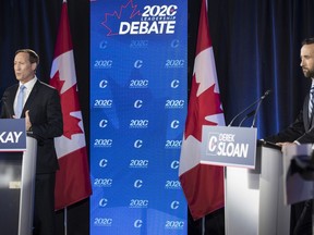 Conservative Party of Canada leadership candidates Peter MacKay, left, and Derek Sloan participate in the English debate in Toronto on Thursday, June 18, 2020.