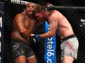 Stipe Miocic throws a punch at Daniel Cormier in the second round during their UFC heavyweight title bout at UFC 241 at Honda Center on August 17, 2019 in Anaheim, California.