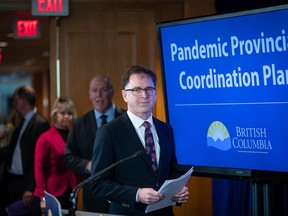 Health Minister Adrian Dix says the B.C. government will announce stricter penalties this week for those who flout public health rules as COVID-19 cases climb in the province. Health Minister Adrian Dix, front, B.C. Premier John Horgan and provincial health officer Dr. Bonnie Henry arrive for a news conference about the provincial response to the coronavirus, in Vancouver, B.C., Friday, March 6, 2020.