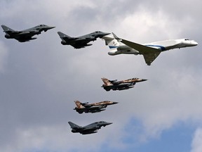 Eurofighter planes of the German Air force, a Learjet and F-16 planes of the Israeli Air Force fly on August 18, 2020 in a formation over the air force's air base in Fuerstenfeldbruck near Munich.