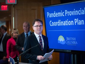 Health Minister Adrian Dix, front, B.C. Premier John Horgan and provincial health officer Dr. Bonnie Henry arrive for a news conference about the provincial response to the coronavirus, in Vancouver, B.C., Friday, March 6, 2020.