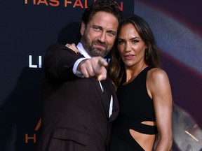 Gerard Butler and girlfriend Morgan Brown arrive for the Los Angeles premiere of "Angel Has Fallen" at the Regency Village theatre on Aug. 20, 2019 in Westwood, Calif.
