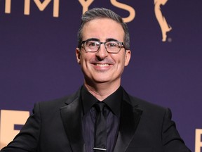 British comedian and television host John Oliver poses with the Emmy for Outstanding Variety Talk Series and Outstanding Writing For A Variety Series awards for "Last Week Tonight with John Oliver" during the 71st Emmy Awards at the Microsoft Theatre in Los Angeles on Sept. 22, 2019.