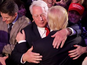 Donald Trump, right, hugs his brother Robert Trump at the New York Hilton Midtown in the early morning hours of Nov. 9, 2016 in New York City after defeating Democratic presidential nominee Hillary Clinton to become the 45th president of the United States.