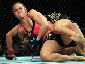 Felice Herrig and Paige VanZant grapple in their women's strawweight bout during the UFC Fight Night event at Prudential Center on April 18, 2015 in Newark, New Jersey.