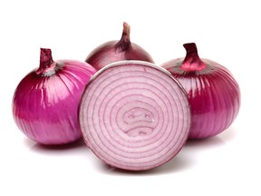 Red onion over white background.