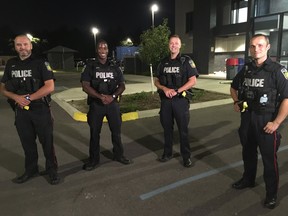 From left: Peel Regional Police Const. Ihor Palchynskyy, Const. Alvin Bayley Sgt. Shaun Stanley and Const. Martin Boreczek are being heralded for their heroic actions in saving a boy, 7, who was dangling from his sixth-floor apartment on Friday, Aug. 14, 2020.