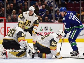 Dec 19, 2019; Vancouver, British Columbia, CAN; Vancouver Canucks forward Tanner Pearson (70) scores a goal past Las Vegas Golden Knights goaltender Marc-Andre Fleury (29) and defenseman Nate Schmidt (88) during the first period at Rogers Arena. Mandatory Credit: Anne-Marie Sorvin-USA TODAY Sports