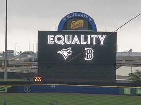 The Toronto Blue Jays display Equality on the scoreboard prior to the game against the Boston Red Sox at Sahlen Field