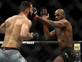 Dominick Reyes, left, and Jon Jones in their UFC Light Heavyweight Championship bout during UFC 247 at Toyota Center on Feb. 8, 2020 in Houston, Tex.