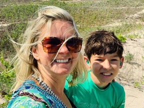 Dorota Simpson, pictured with her 11-year-old son Lukas, says there will be challenges for children who are deaf and hard of hearing in the classroom, especially with masks. She's advocating for educators to wear clear masks or face shields in order for students to be able to read lips.
