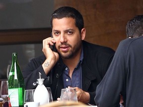 Magician David Blaine on the phone while having lunch with a friend at a Greenwich restaurant.