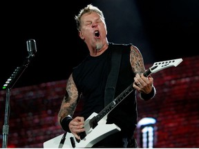 James Hetfield, lead vocalist of the heavy metal group Metallica performs during their World Magnetic tour concert in Abu Dhabi October 25, 2011.
