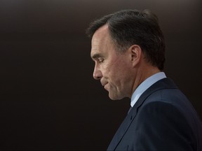 Minister of Finance Bill Morneau announces his resignation during a news conference on Parliament Hill in Ottawa, on Monday, Aug. 17, 2020.