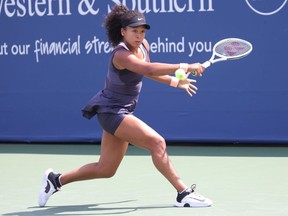 Naomi Osaka returns a shot against Anett Kontaveit during the Western and Southern Open at the USTA Billie Jean King National Tennis Center on August 26, 2020 in New York.
