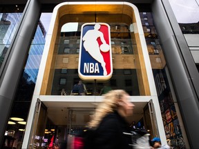 A pedestrian walks past the NBA store on 5th Avenue on March 12, 2020 in New York City.