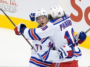 Artemi Panarin of the New York Rangers celebrates with Tony DeAngelo after scoring against the Carolina Hurricanes in Game 2 of the Eastern Conference Qualification Round at Scotiabank Arena on August 3, 2020 in Toronto.